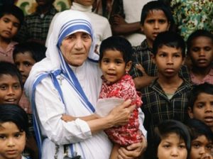 nun holding child